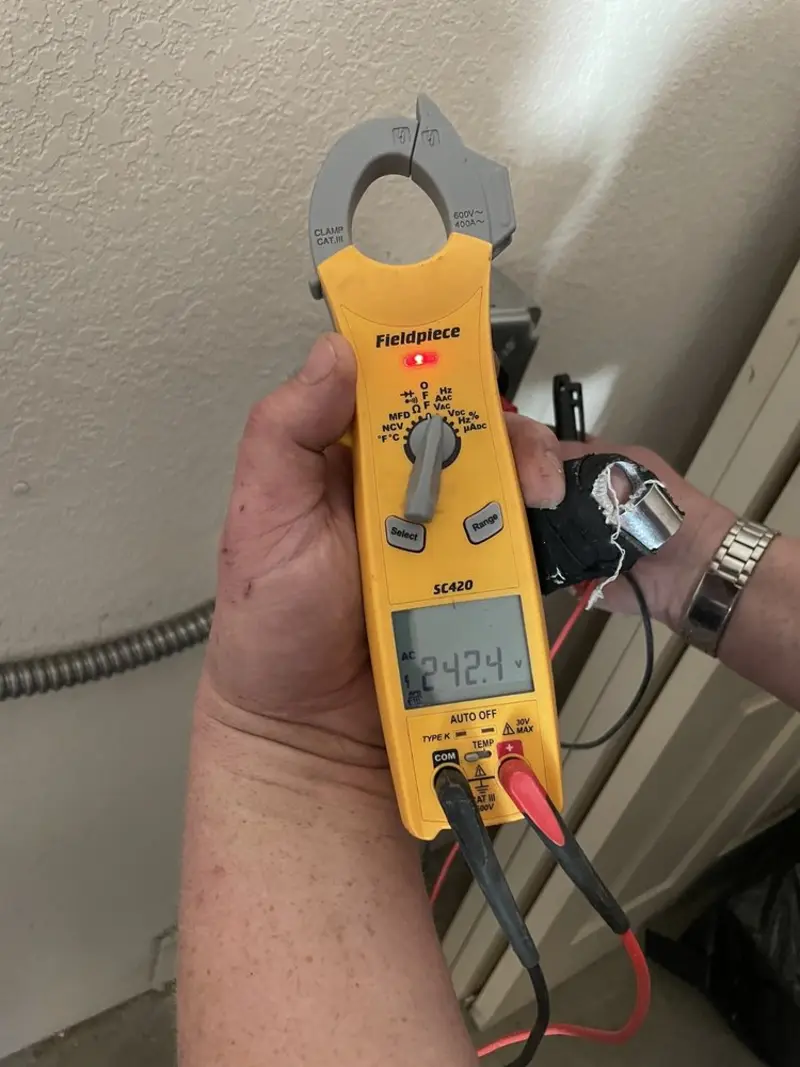 Voltage testing with clamp meter during Ceiling Fan Installation in Acton